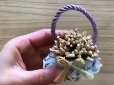 如何利用汽水瓶盖手工制作花篮